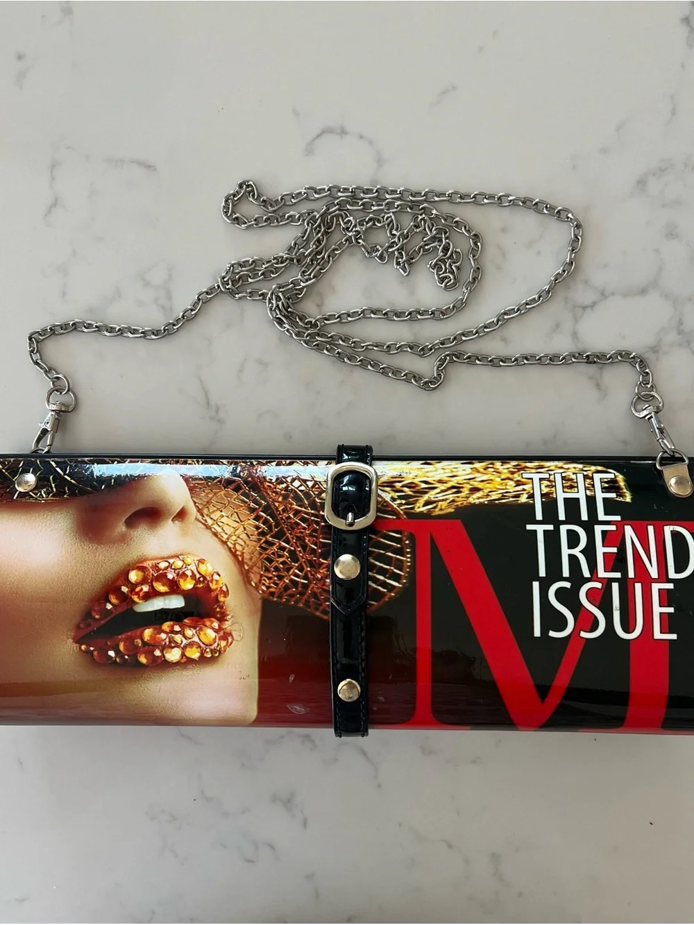 Edgy 80s rolled magazine clutch hard case with crossbody chain red and black